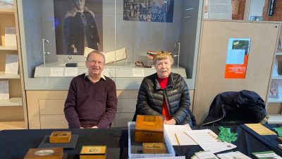 Friends of the Amelia Scott - a female and a male with artifacts