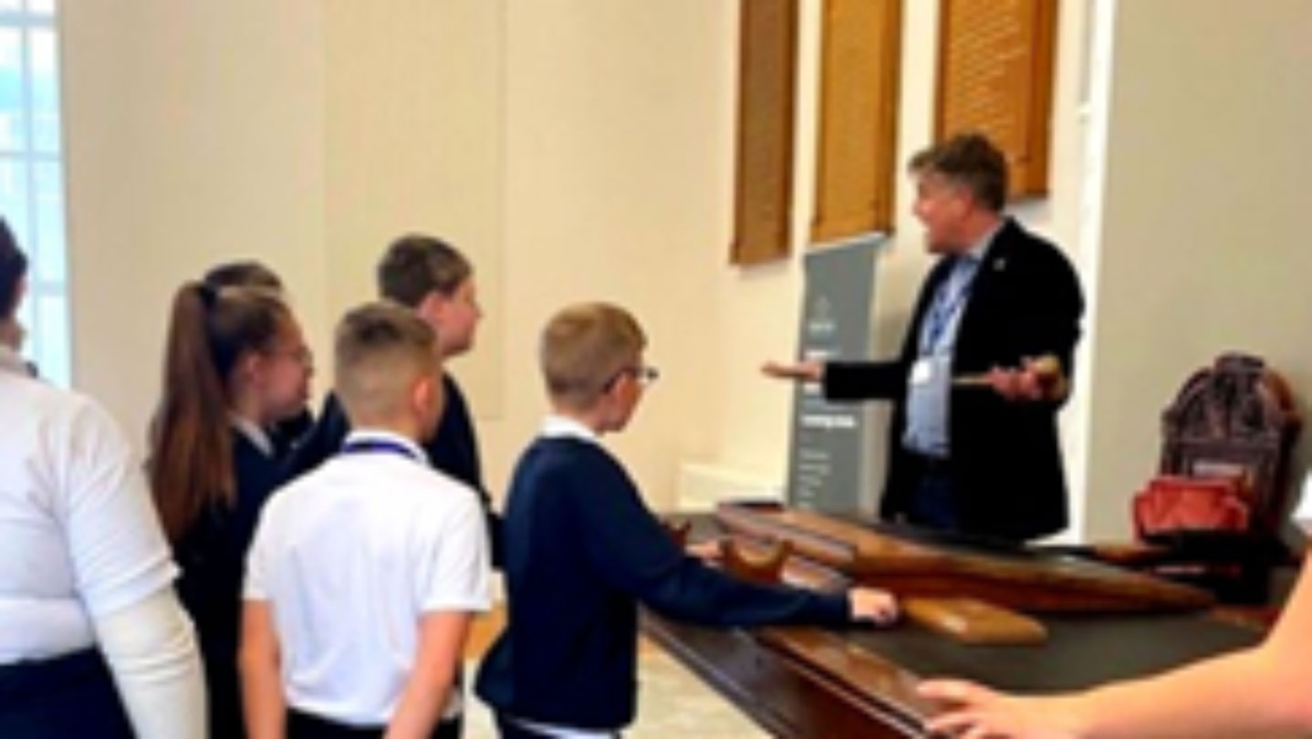 Students from Oakley School Council visit the Amelia Scott with The Chief Executive William Benson talking to them