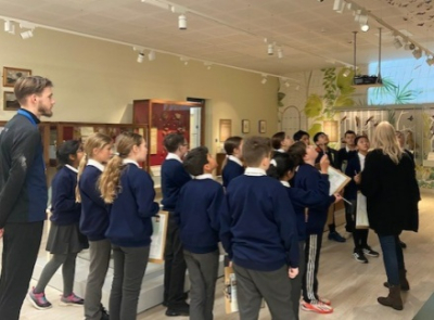 Students in school uniform visiting The Amelia Scott