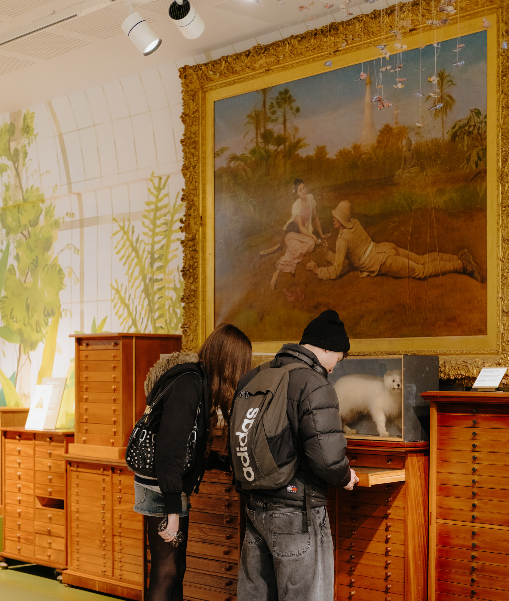 TheAmelia-General-35 2 people looking at whats in drawers in the museum