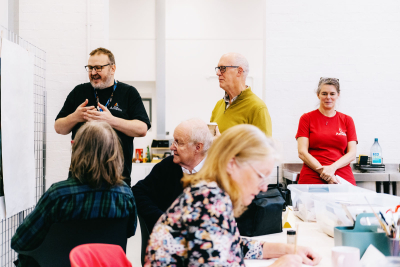 Multiple people working in a workshop setting
