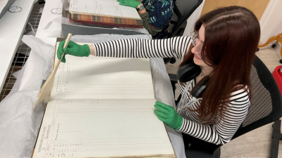 Isla working on an old book