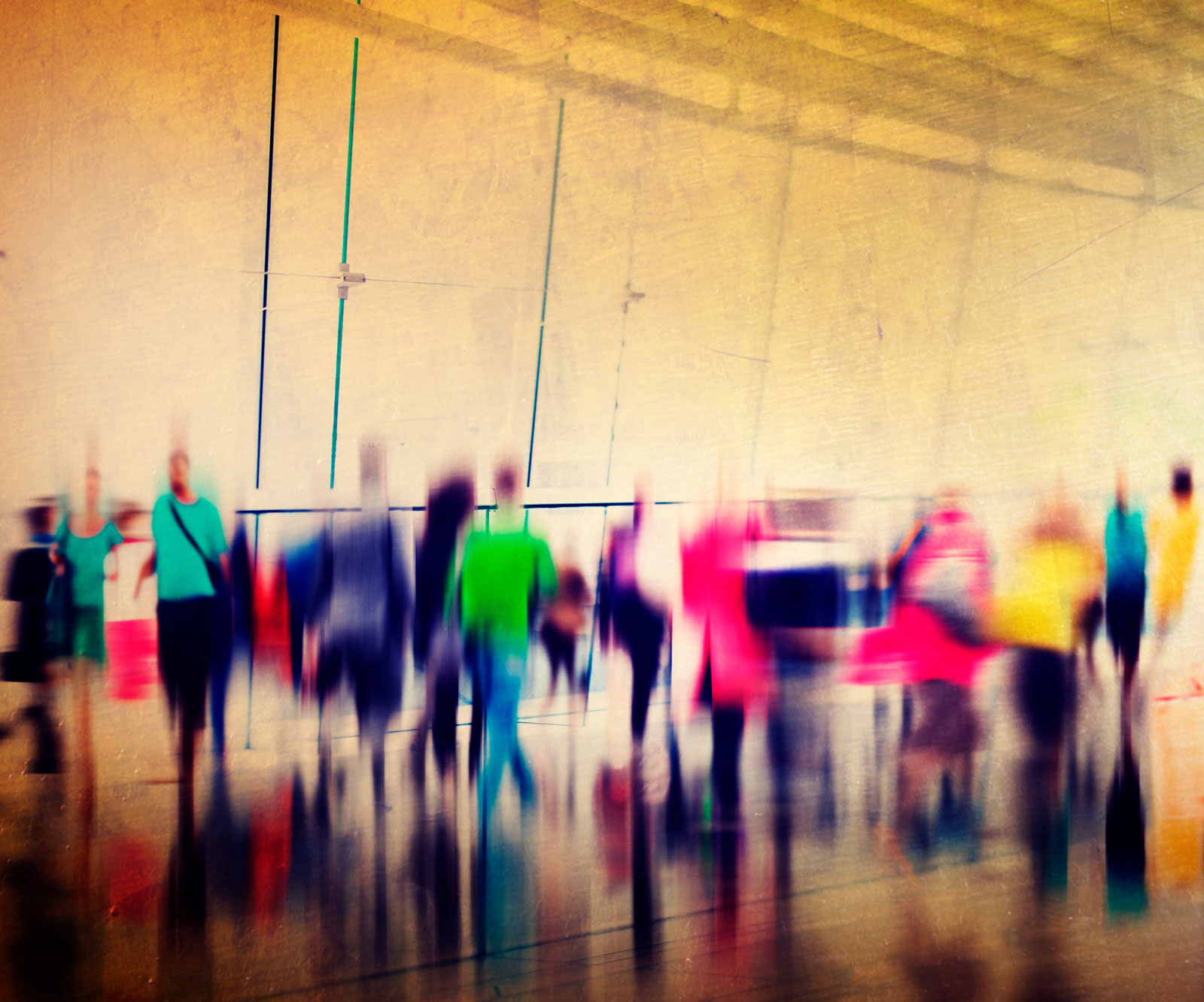 Abstract image of people walking about in exhibition space