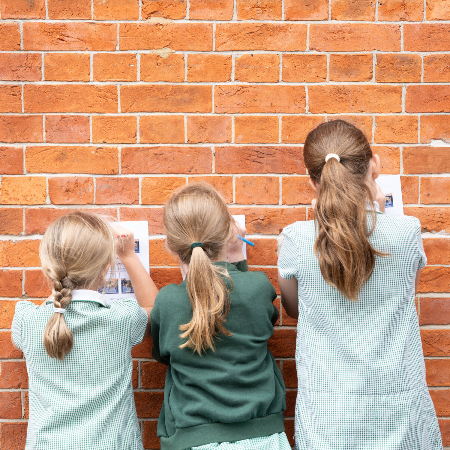 A7R09510-opt 3 girls filling in worksheets