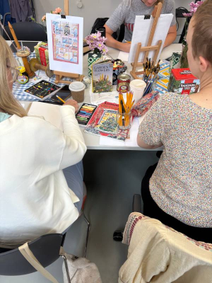 People doing art at a table.