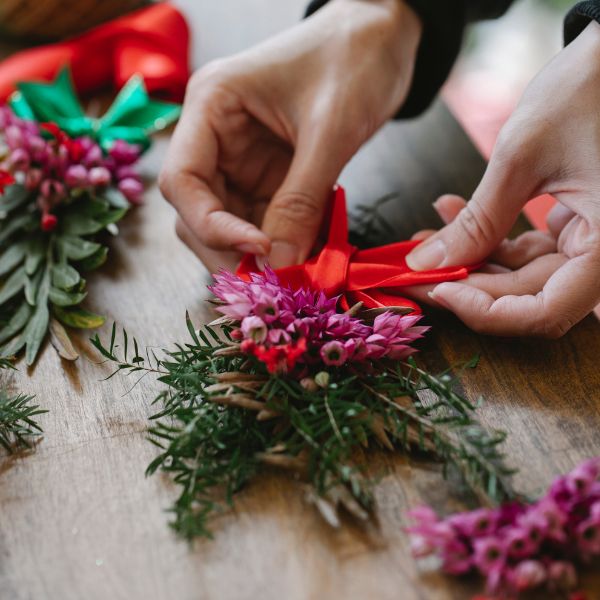 Hands making a Christmas decoration
