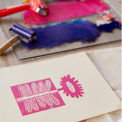 Image of a lino print and rollers.