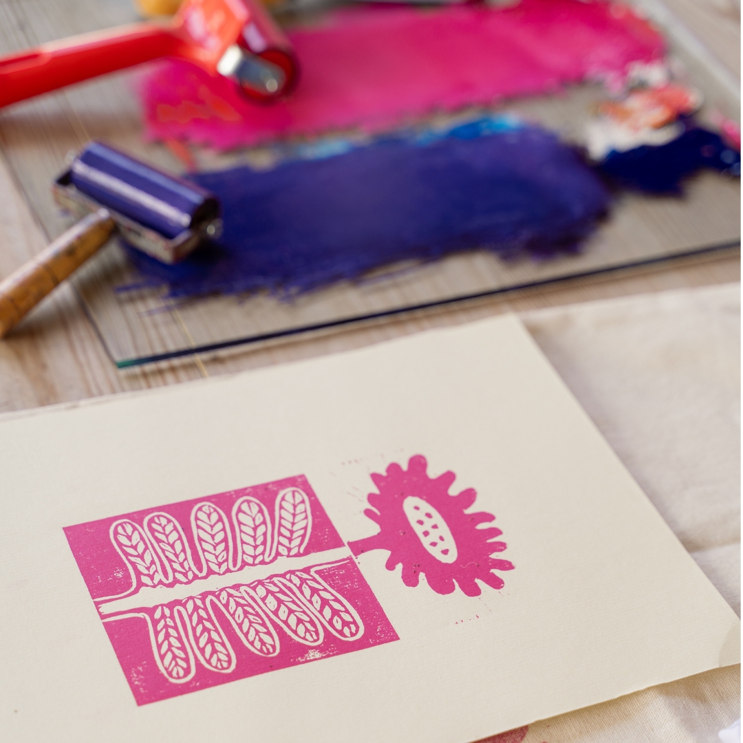 Image of a lino print and rollers.