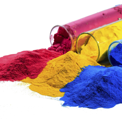 Red, yellow and blue pigments spilling out of glass test tubes.