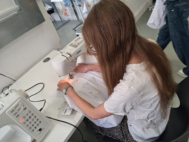 5 girl using sewing machine